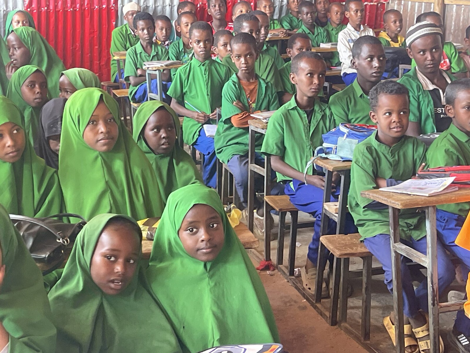 Pupils in school uniform at their desks in a Somali classroom