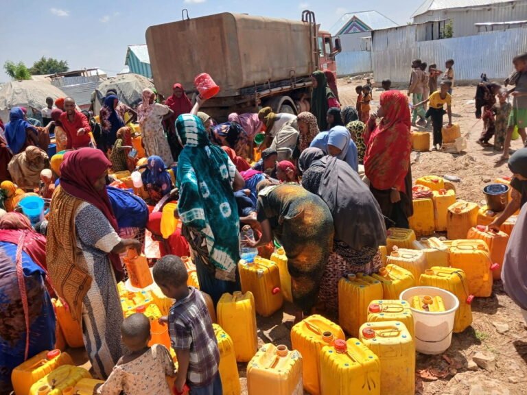 Emergency water distribution at a displacement camp