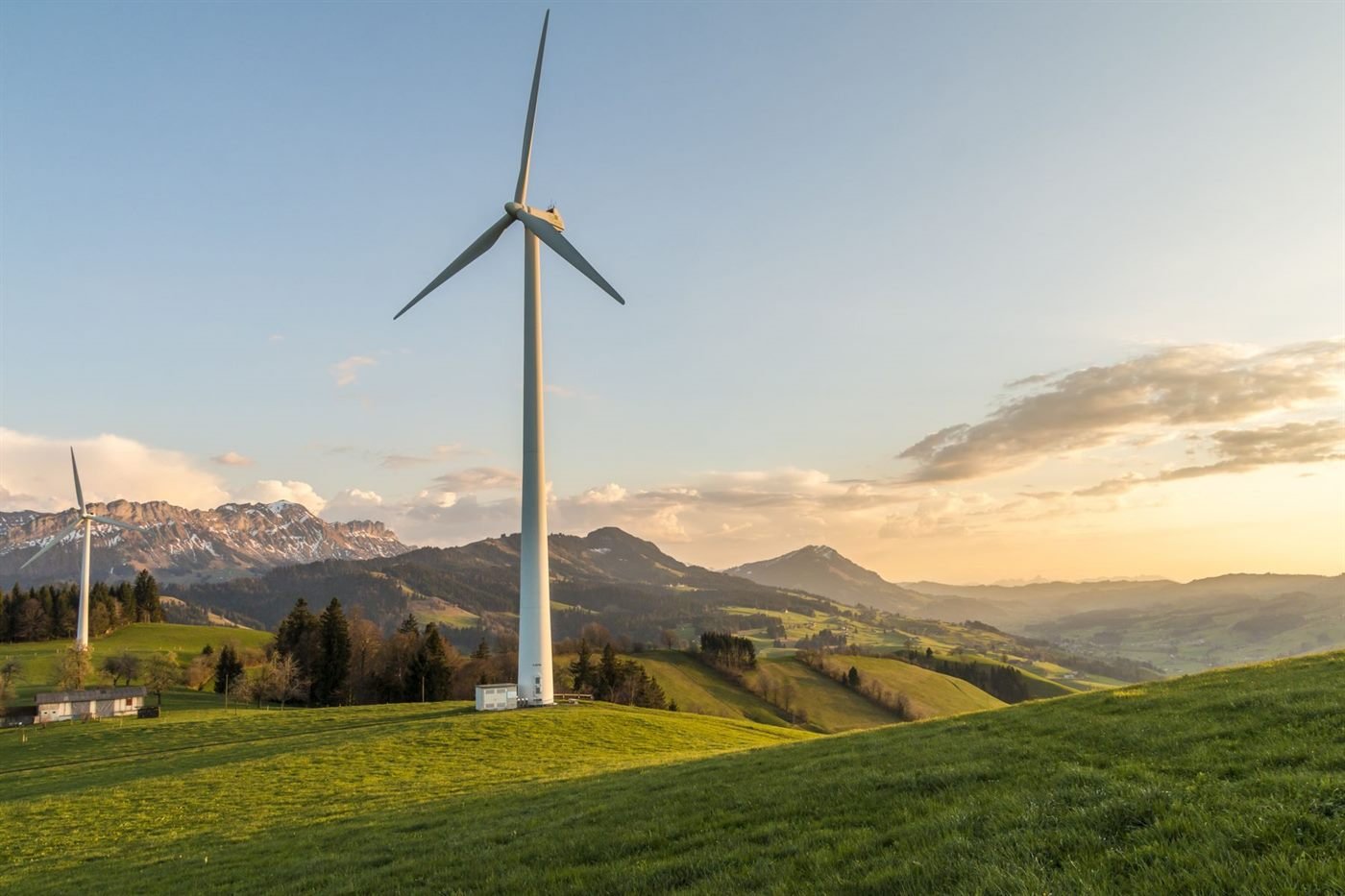 Wind turbines generating renewable electricity across an open landscape